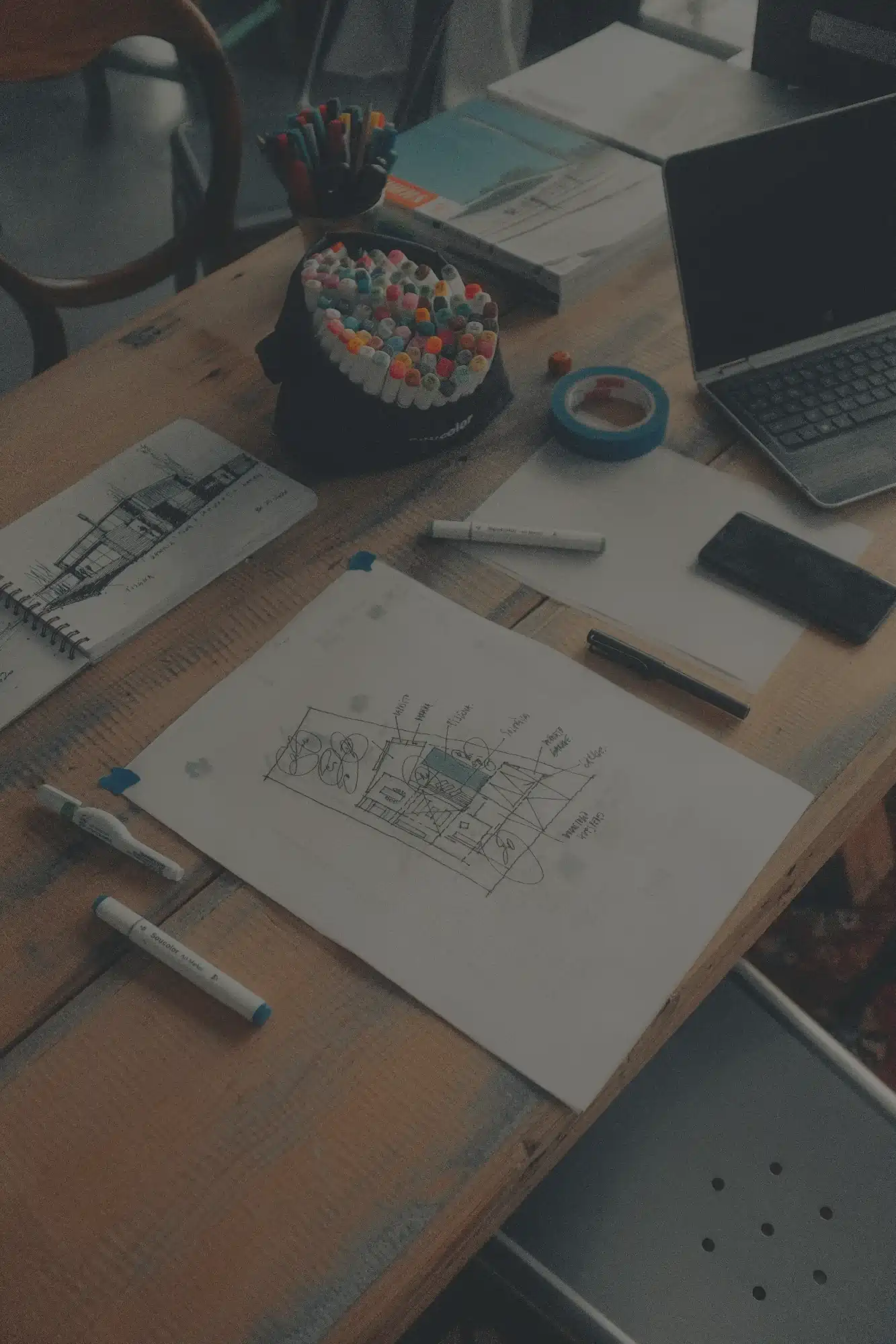 A creative workspace with sketches and notes for character-driven storytelling