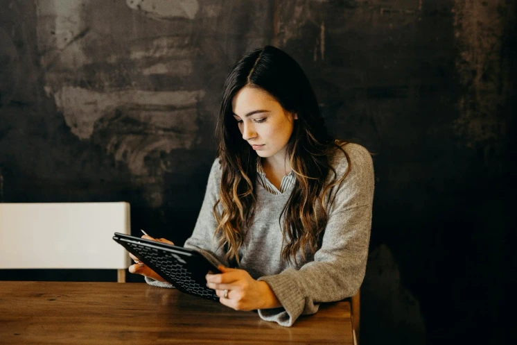 Person strategizing eBook marketing using digital tools